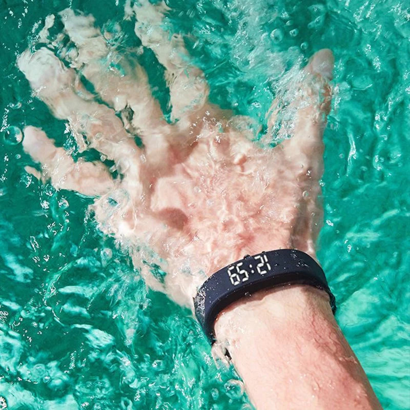Fitnessniches Smart Bracelet with LED digital display, showcasing sleek design and adjustable strap in vibrant colors.