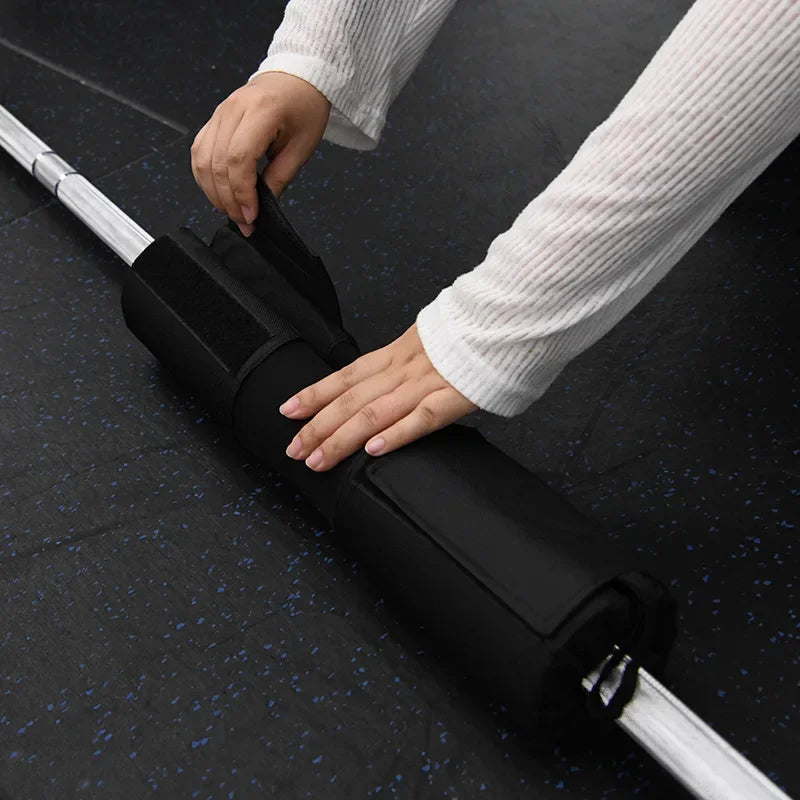 Fitnessniches barbell squat pad in black, designed for comfort and support during squats and weightlifting exercises.